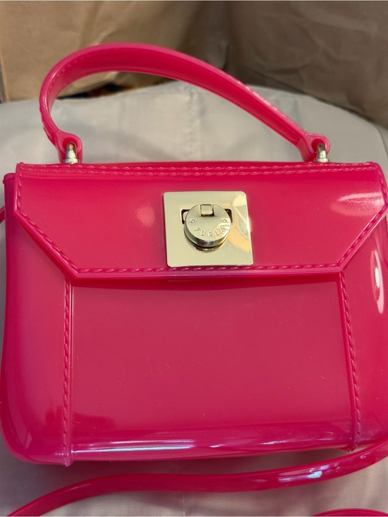 Furla Handbags - Furla Hot Pink Jelly Crossbody Bag EUC
With free Furla Bag Charm